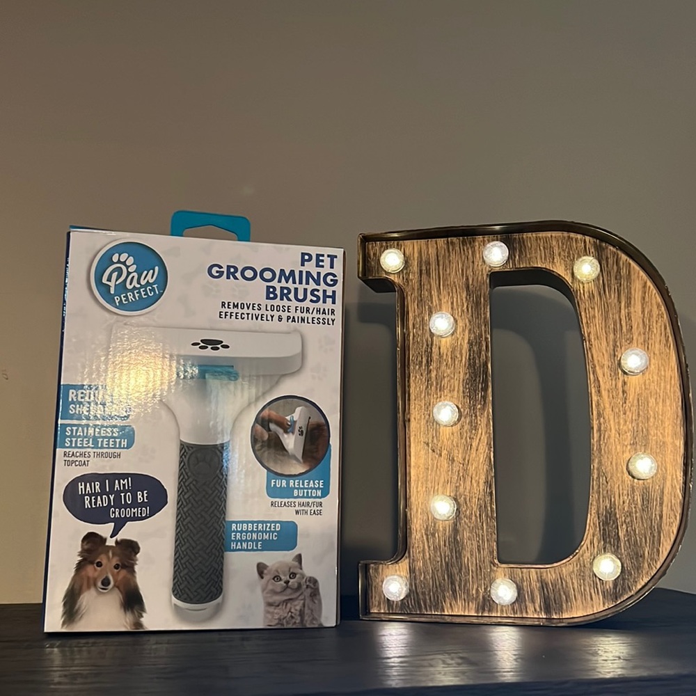 Paw perfect pet grooming brush